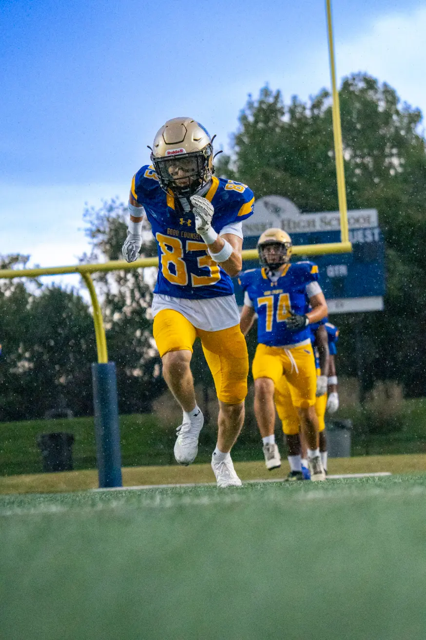 Player number 83 running a route through the rain
