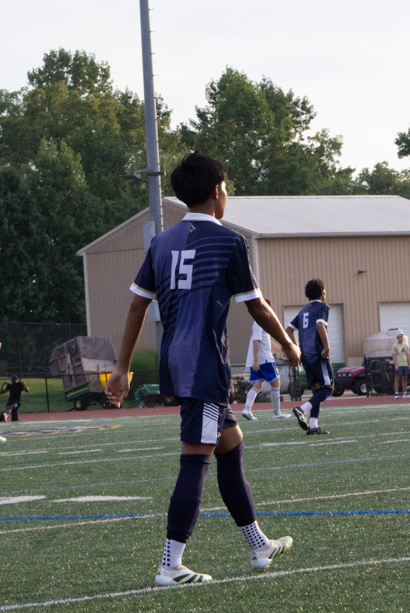 Soccer player number 15 walking the field